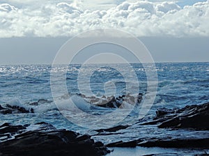 Coastline and rugged lava rocks called DragonÃ¢â¬â¢s Teeth and crashing waves at Makaluapuna Point near Kapalua, Maui, HI, USA